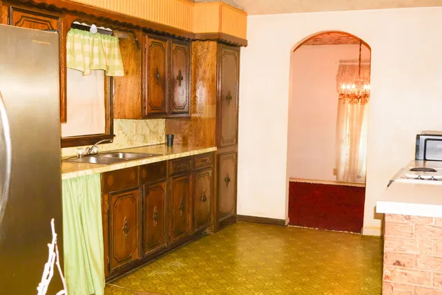 a bathroom with a sink mirror and vanity