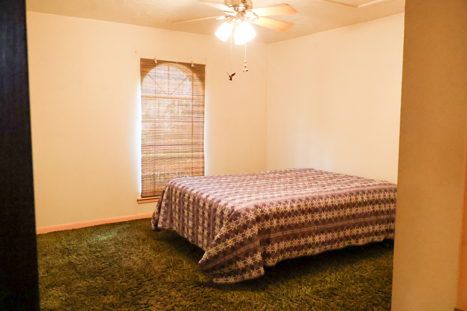 3680 Holly Grove Road Livingston, TX 77351 - Photo 10 of 24 a bedroom with a bed and a window