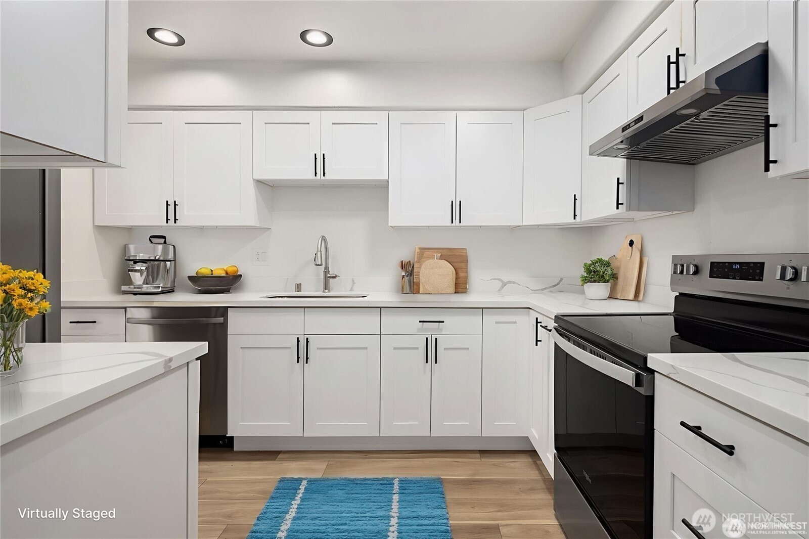 9 76th Street Southeast Everett, WA 98203 - Photo 11 of 28 a kitchen with cabinets appliances a sink and a counter space