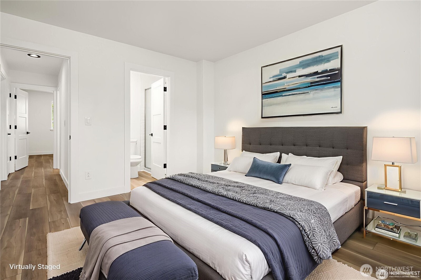 9 76th Street Southeast Everett, WA 98203 - Photo 16 of 28 a bedroom with a large bed and a painting on the wall