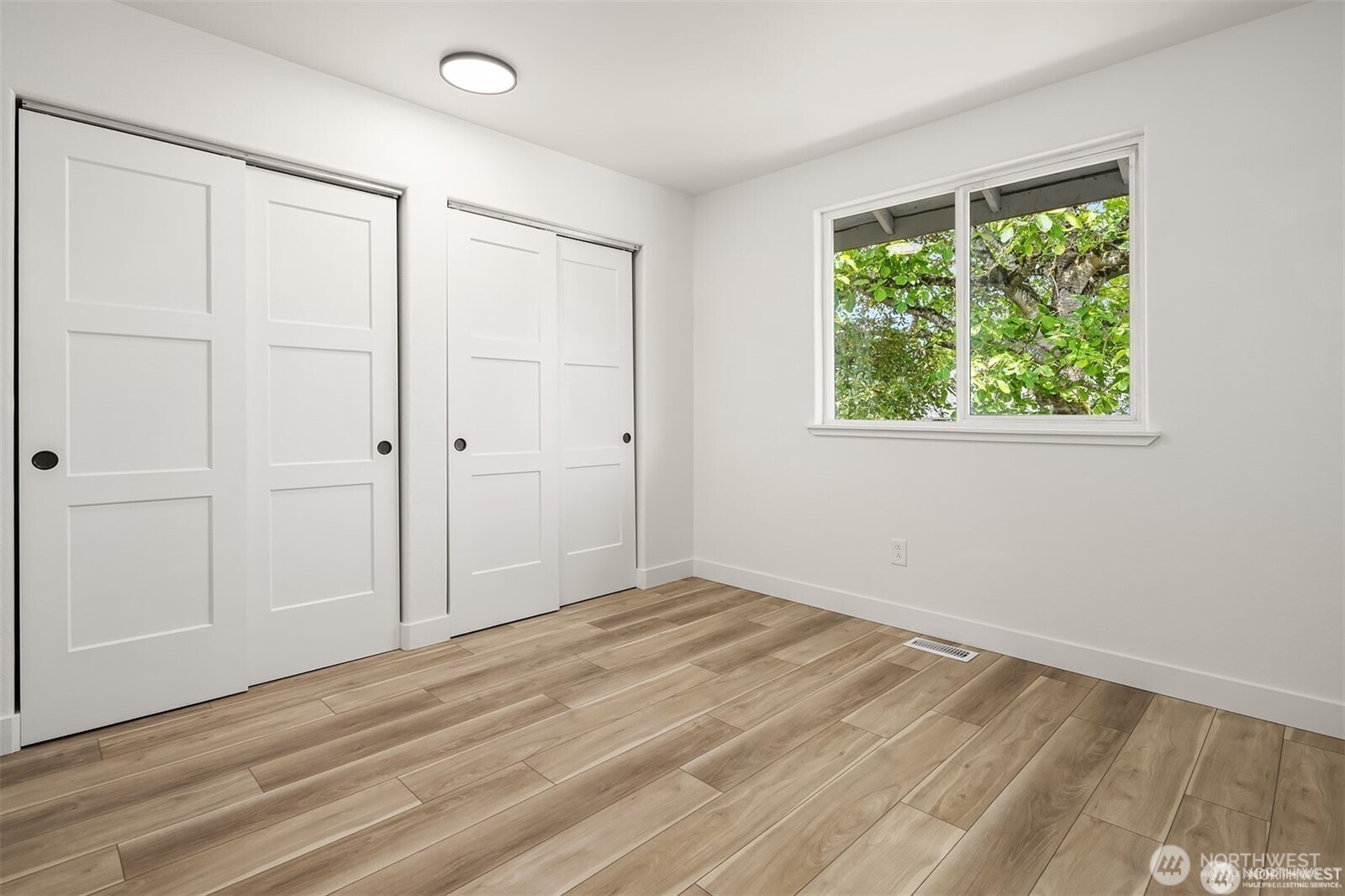 9 76th Street Southeast Everett, WA 98203 - Photo 18 of 28 wooden floor in an empty room with a window