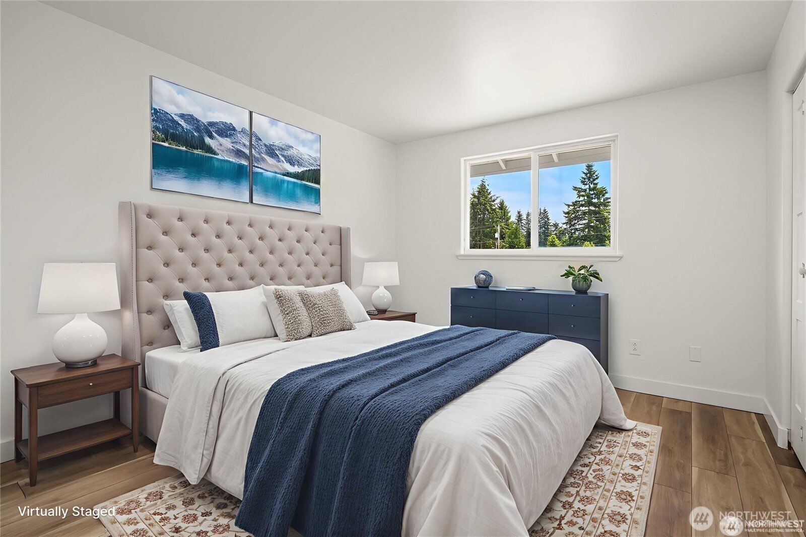 9 76th Street Southeast Everett, WA 98203 - Photo 20 of 28 a bed room with a bed and a painting on the wall