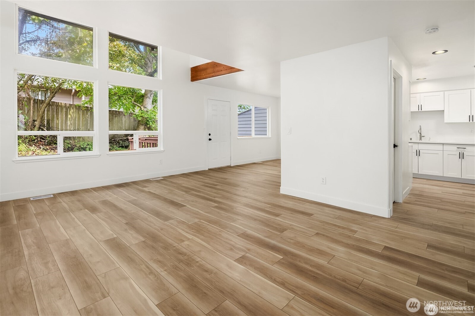 9 76th Street Southeast Everett, WA 98203 - Photo 3 of 28 an empty room with wooden floor and windows