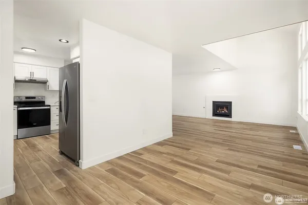 a view of a kitchen from the hallway