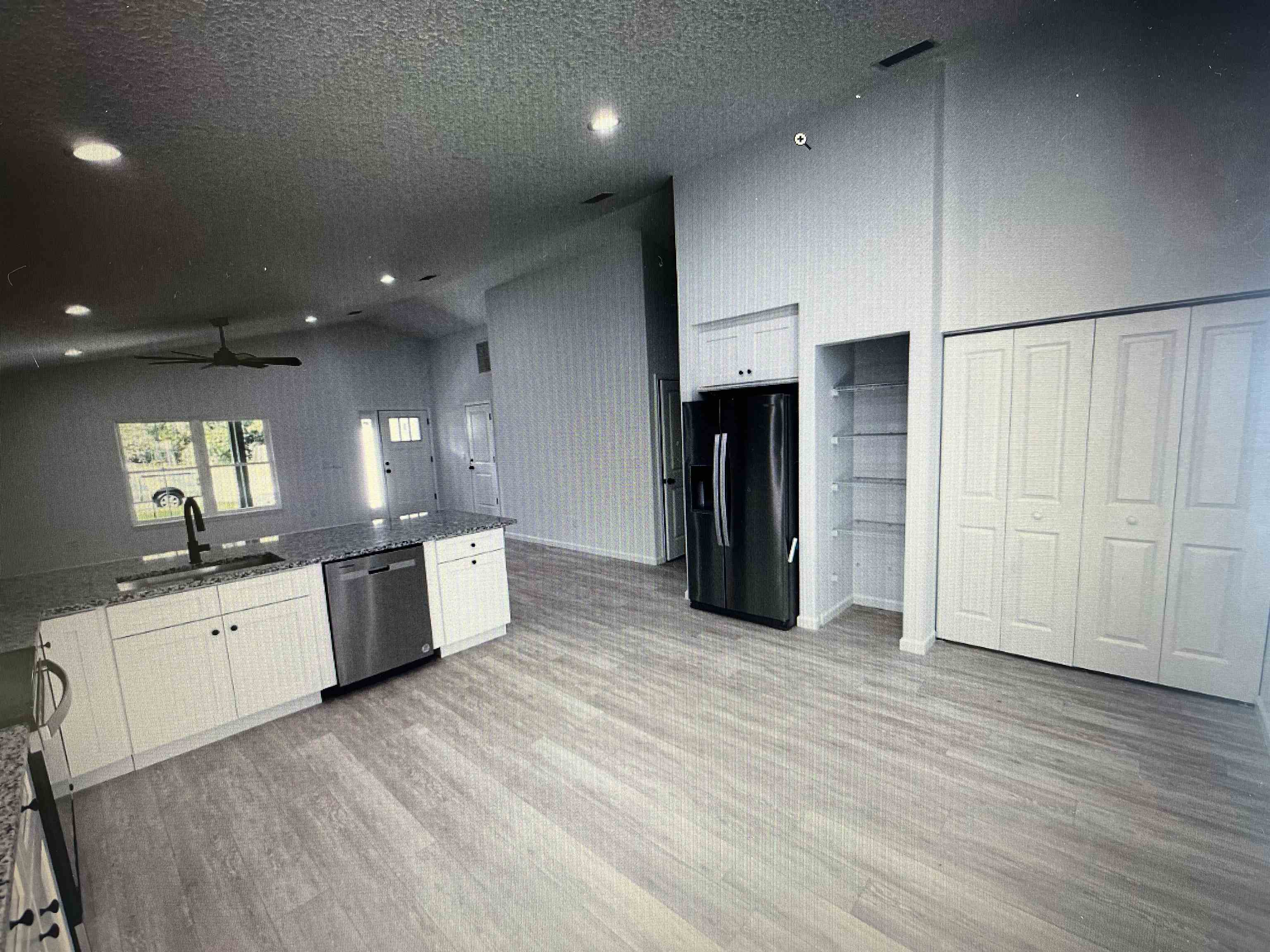 231 Monterey Avenue St. Augustine, FL 32084 - Photo 3 of 15 a large kitchen with a large counter top space a sink stainless steel appliances and cabinets