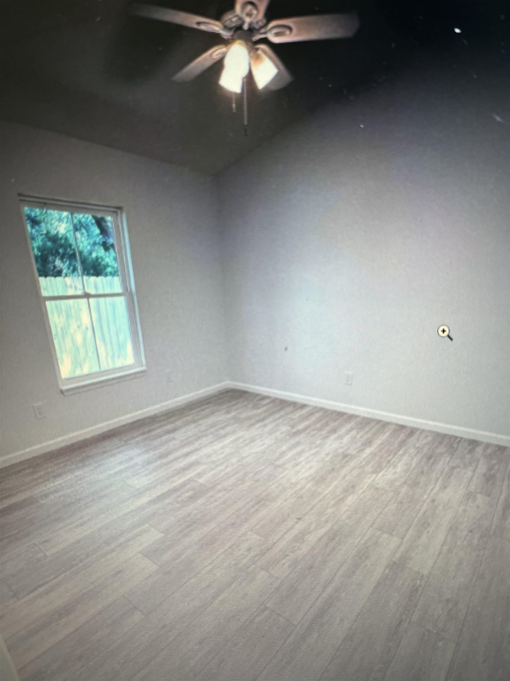 231 Monterey Avenue St. Augustine, FL 32084 - Photo 6 of 15 an empty room with a window and a fan