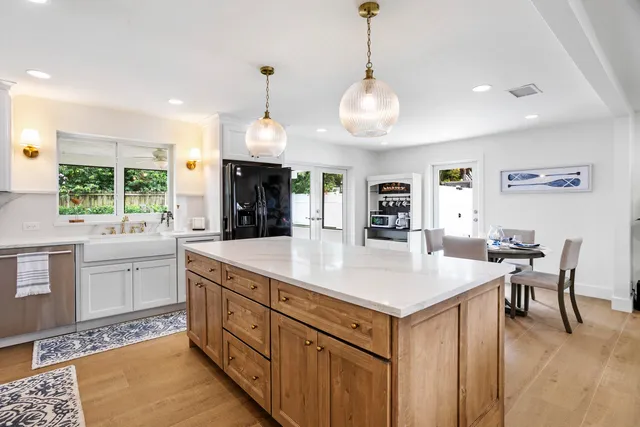 a kitchen with a counter space window and cabinets