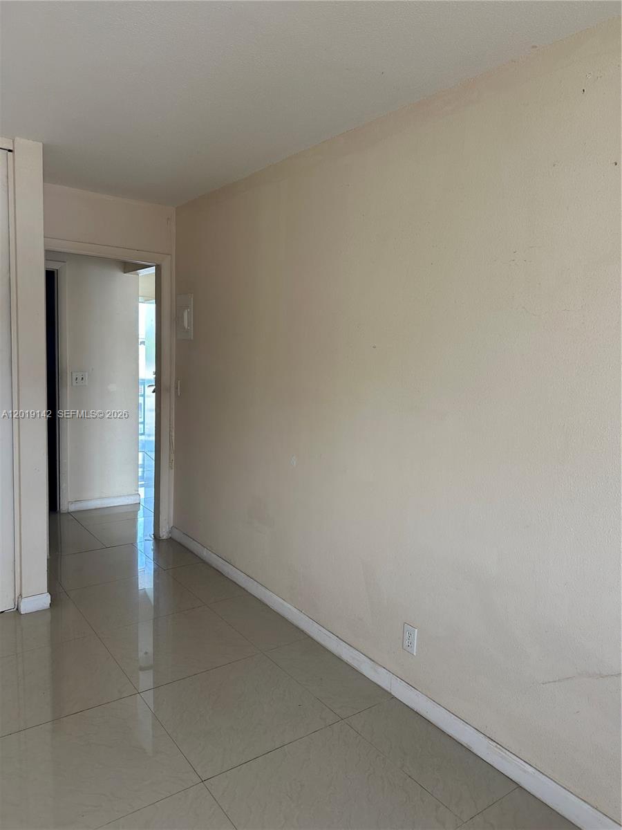 1050 East Sample Road, Unit 208 Pompano Beach, FL 33064 - Photo 6 of 9 a view of an empty room