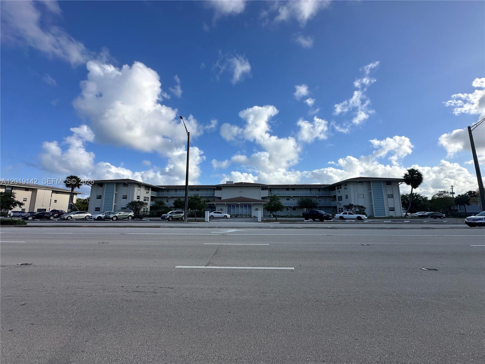1050 East Sample Road, Unit 208 Pompano Beach, FL 33064 - Photo 9 of 9 a view of a house and a street
