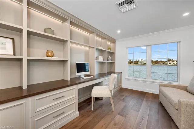 a work place with wooden floor and furniture