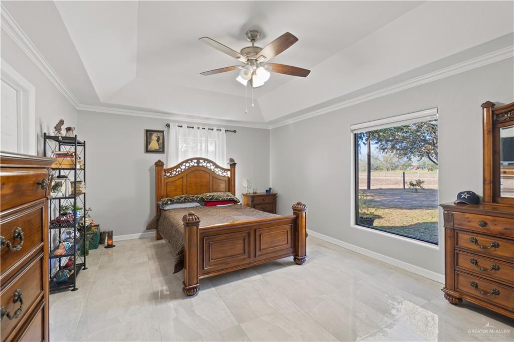 9230 North Moorefield Road Mission, TX 78574 - Photo 12 of 27 a bedroom with furniture and natural light