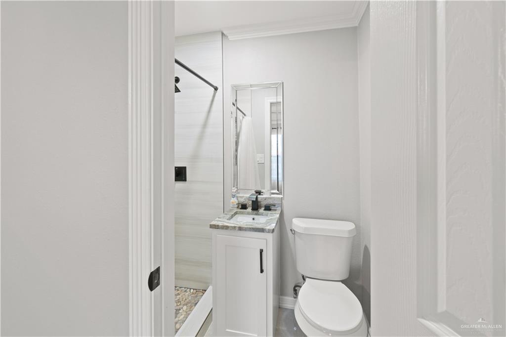 9230 North Moorefield Road Mission, TX 78574 - Photo 17 of 27 a bathroom with a sink a toilet and shower