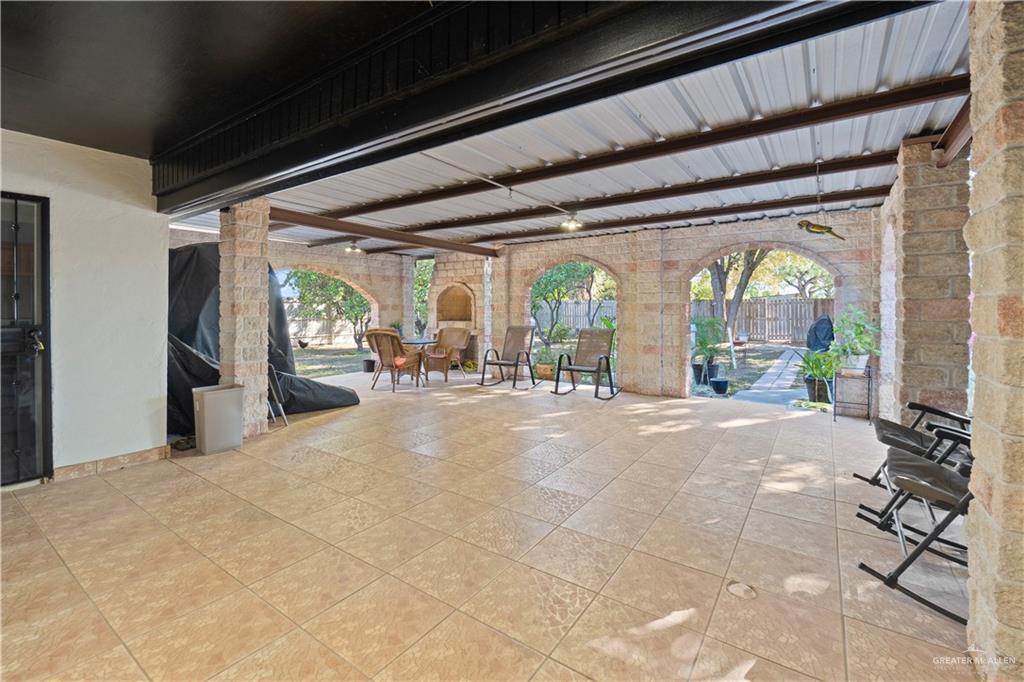 9230 North Moorefield Road Mission, TX 78574 - Photo 19 of 27 a very nice looking room with large windows and chandelier