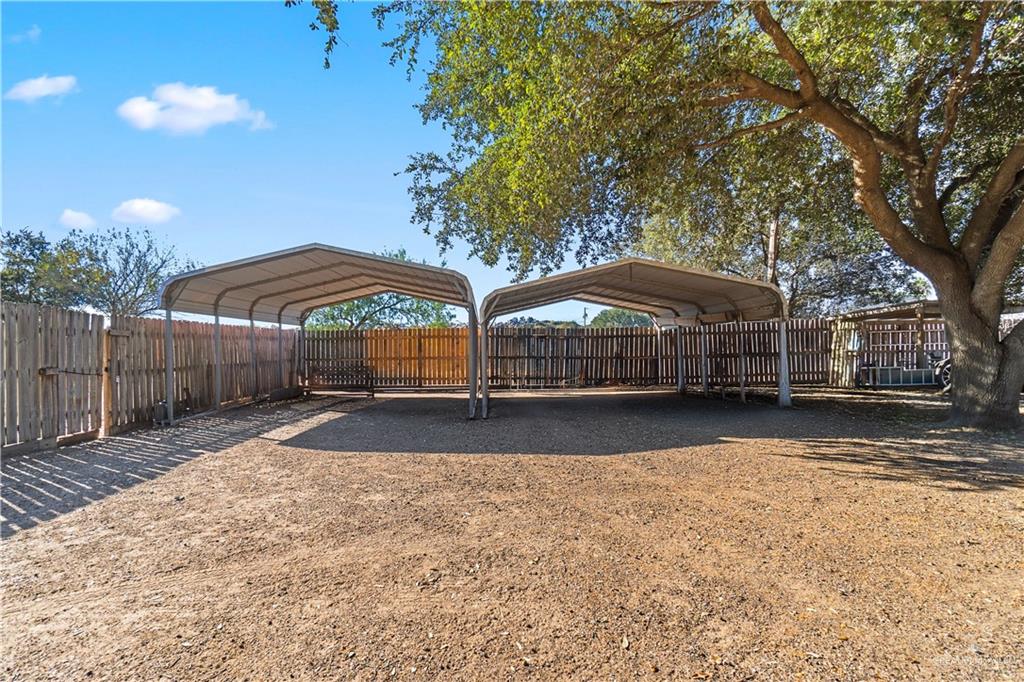 9230 North Moorefield Road Mission, TX 78574 - Photo 22 of 27 a view of street with house and trees in the background