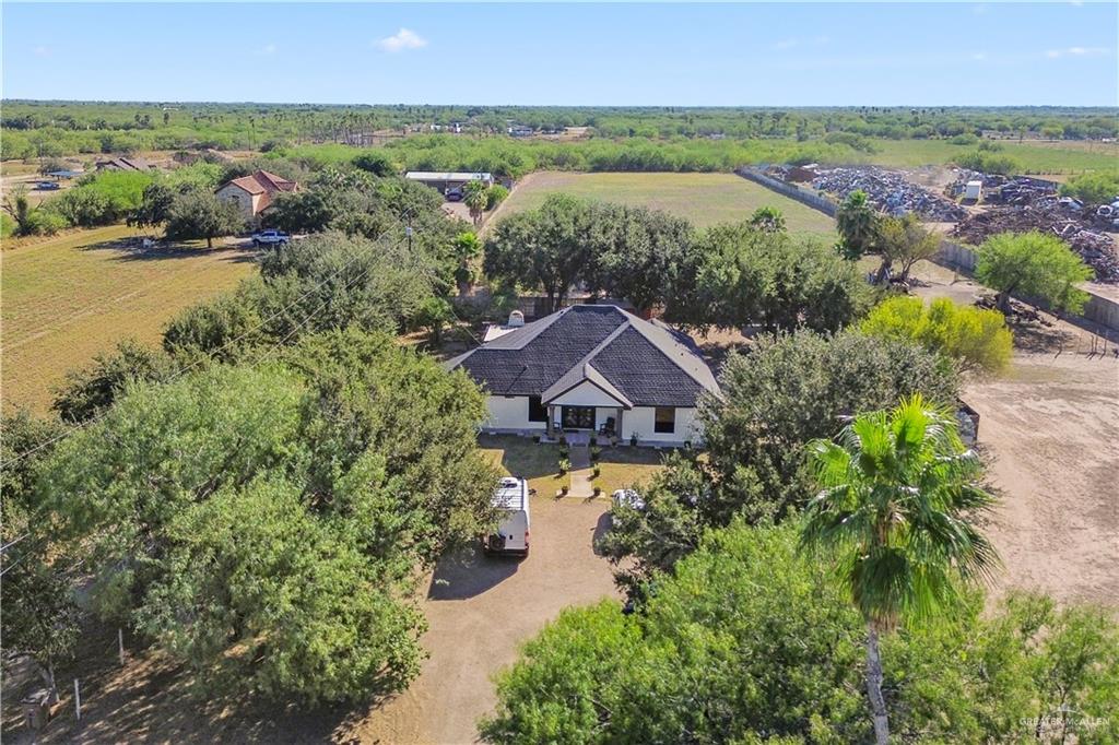 9230 North Moorefield Road Mission, TX 78574 - Photo 23 of 27 an aerial view of a house with a garden and lake view