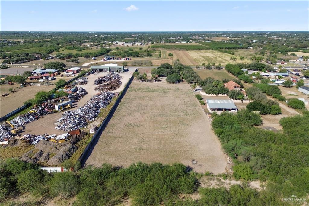 9230 North Moorefield Road Mission, TX 78574 - Photo 26 of 27 an aerial view of residential houses with outdoor space and trees