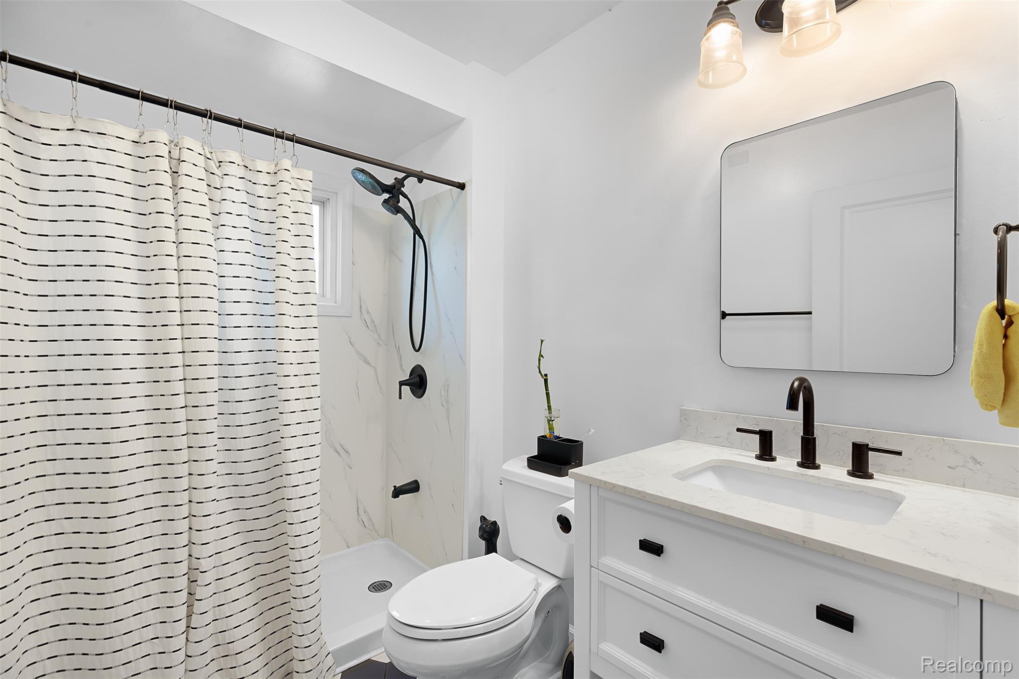 22827 Meridian Road Grosse Ile, MI 48138 - Photo 31 of 36 Bathroom featuring a shower stall and vanity