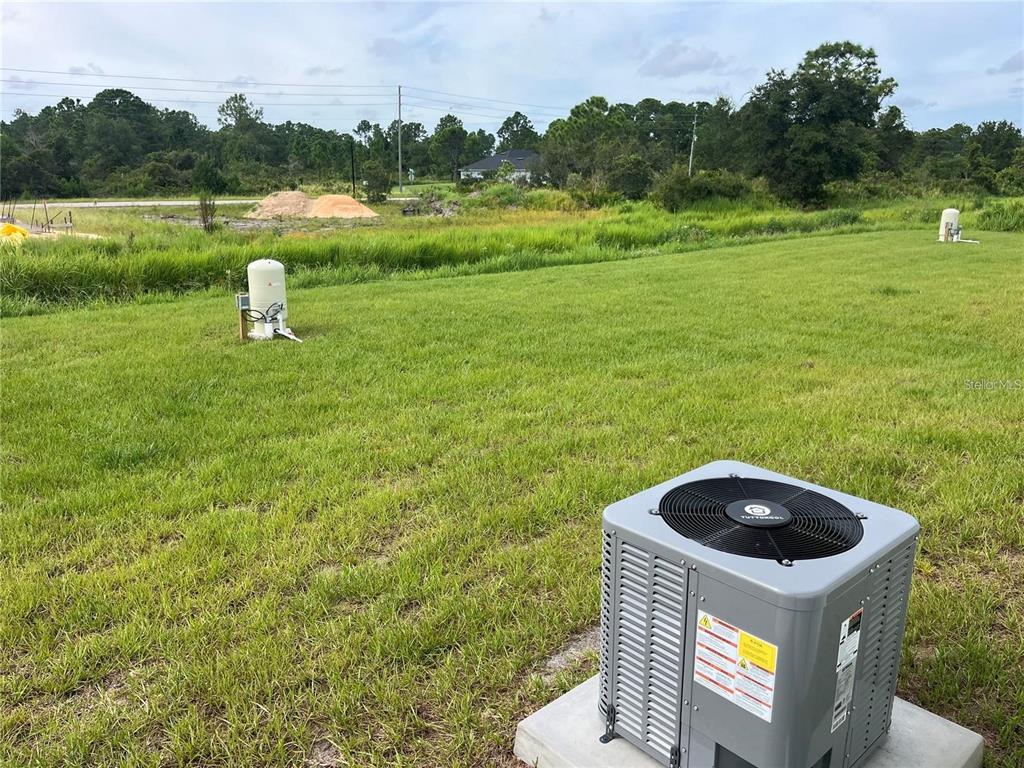 7213 Ancha Street Sebring, FL 33872 - Photo 14 of 18 a house view with a garden space