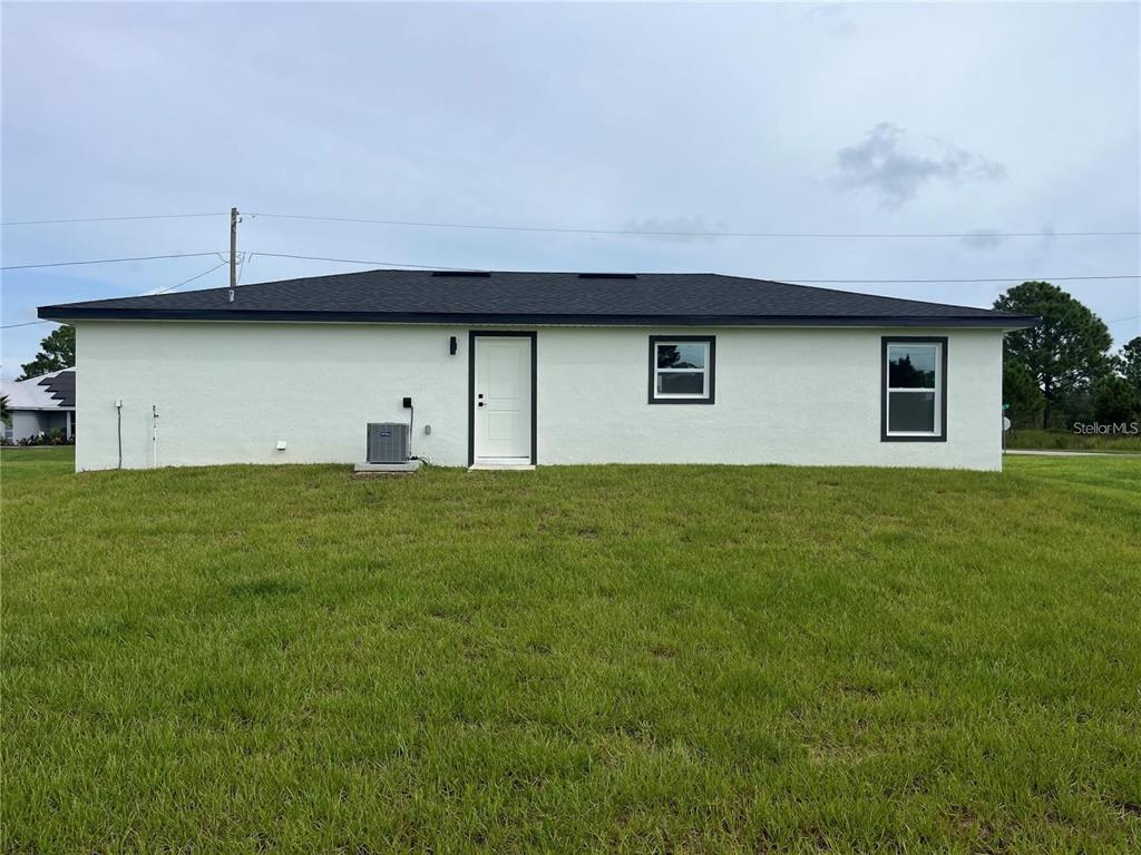 7213 Ancha Street Sebring, FL 33872 - Photo 18 of 18 a house view with a garden space