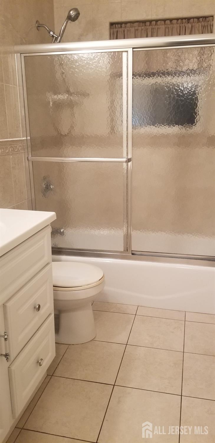 27 Judson Street, Unit 13B Edison, NJ 08837 - Photo 11 of 21 a bathroom with a toilet and a shower