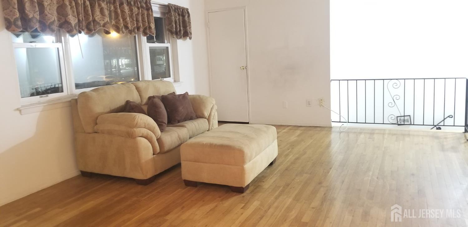 27 Judson Street, Unit 13B Edison, NJ 08837 - Photo 14 of 21 a living room with furniture and a large window