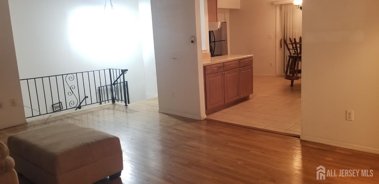 27 Judson Street, Unit 13B Edison, NJ 08837 - Photo 15 of 21 a view of a hallway with wooden floor