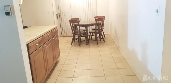 a dining room with furniture and a view of a bathroom