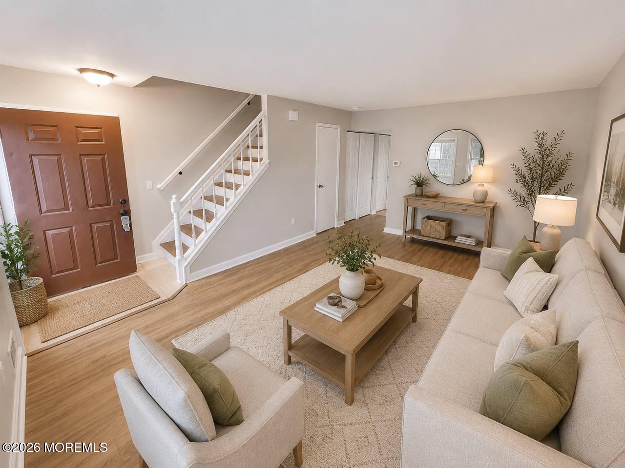 1144 Sawmill Road, Unit 121 Brick, NJ 08724 - Photo 5 of 23 a living room with furniture and a wooden floor