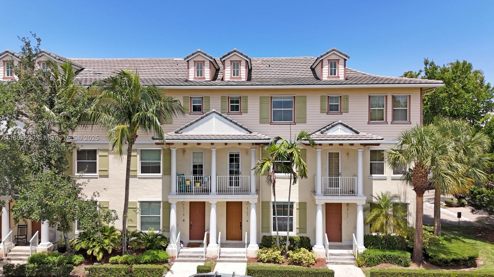4123 Parkside Drive Jupiter, FL 33458 - Photo 2 of 39 front view of a house with a porch