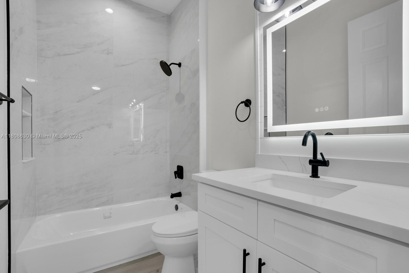 4123 Parkside Drive Jupiter, FL 33458 - Photo 21 of 39 a bathroom with a sink a toilet and shower