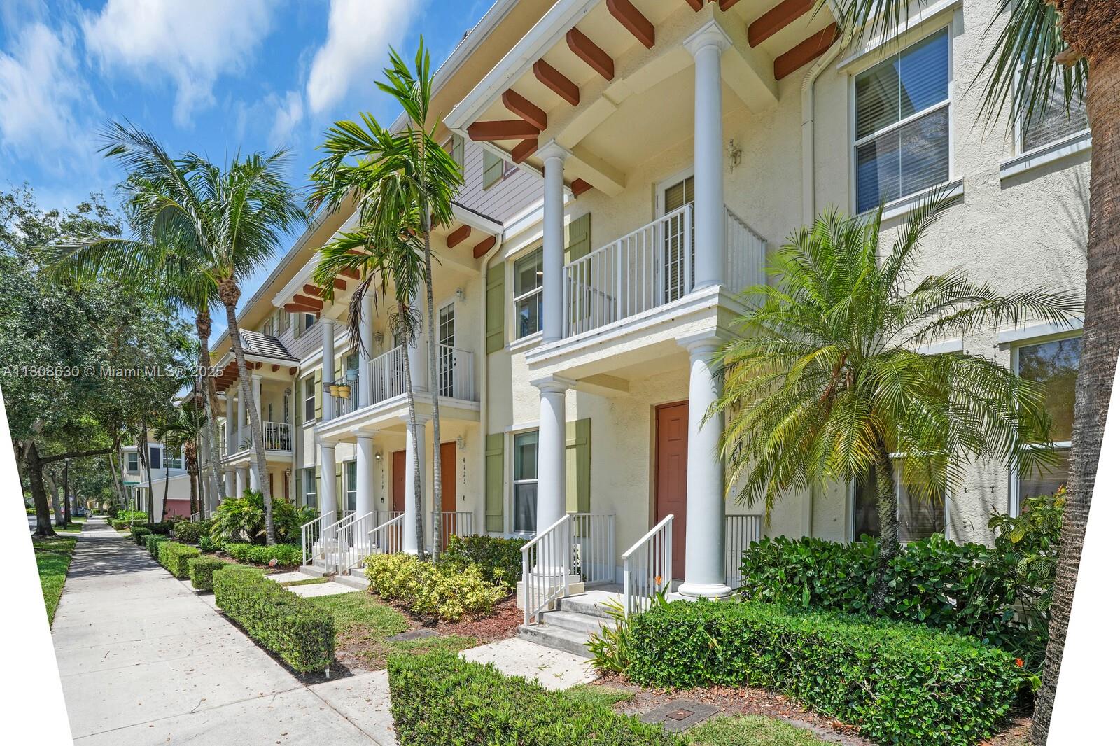 4123 Parkside Drive Jupiter, FL 33458 - Photo 32 of 39 a view of a building with a garden