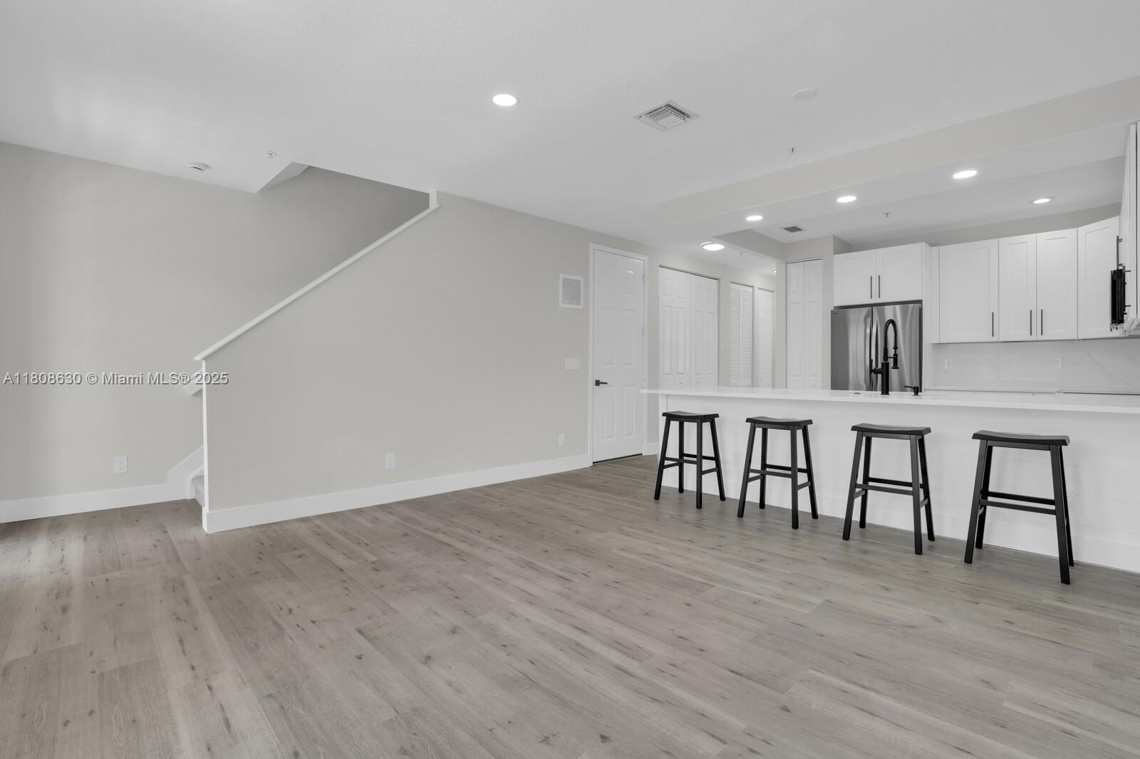 4123 Parkside Drive Jupiter, FL 33458 - Photo 7 of 39 a view of kitchen with furniture and wooden floor