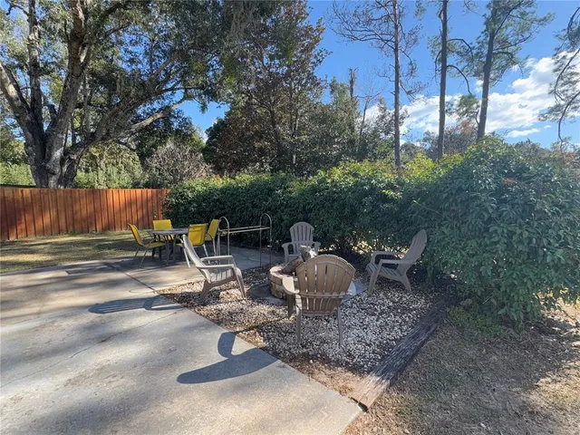 a view of a backyard with sitting area
