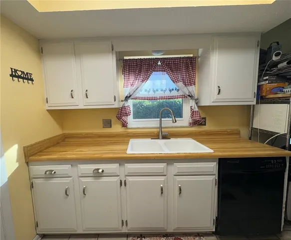 a room with a sink and a stove