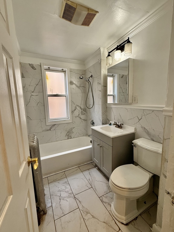 15 Dunlap Street, Unit 1 Boston, MA 02124 - Photo 2 of 8 a bathroom with a bathtub toilet and sink