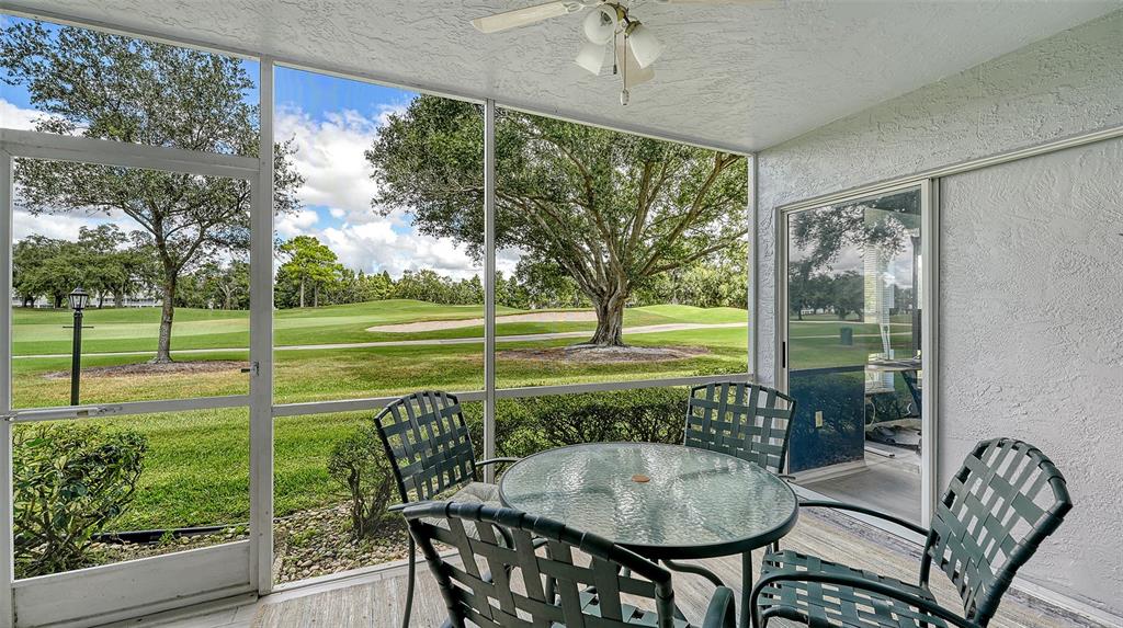 6611 Stone River Road, Unit 103 Bradenton, FL 34203 - Photo 15 of 61 a view of a porch with furniture and garden