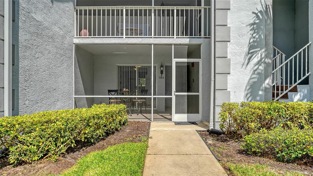 6611 Stone River Road, Unit 103 Bradenton, FL 34203 - Photo 4 of 61 a house view with a garden space