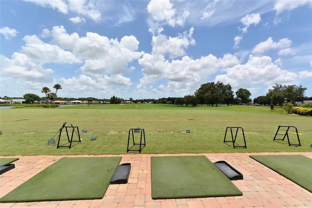 6611 Stone River Road, Unit 103 Bradenton, FL 34203 - Photo 47 of 61 a view of a lake with couches in the patio