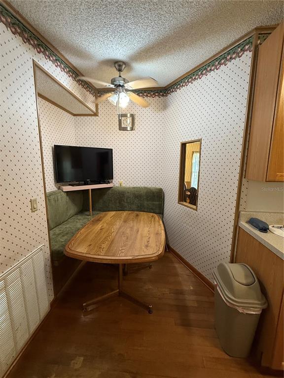 9300 Ottawa Street New Port Richey, FL 34654 - Photo 14 of 37 a room with a table and a chair