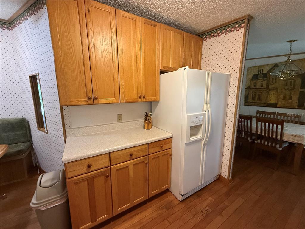 9300 Ottawa Street New Port Richey, FL 34654 - Photo 18 of 37 a white refrigerator freezer sitting next to a window