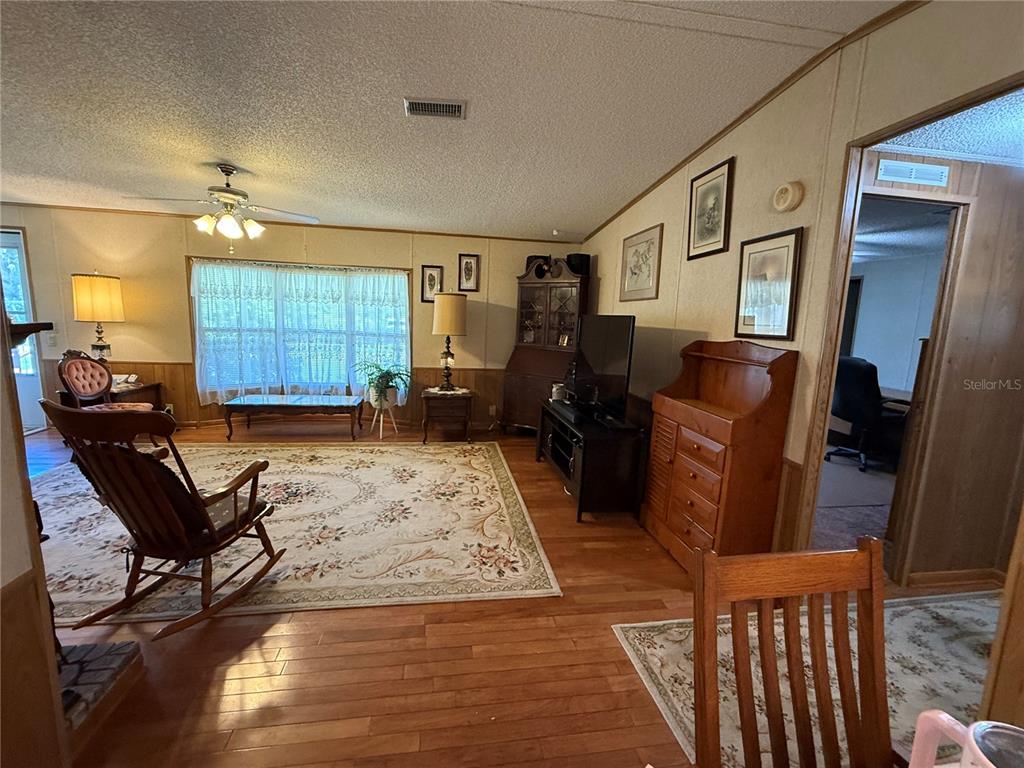 9300 Ottawa Street New Port Richey, FL 34654 - Photo 21 of 37 a living room with furniture and a rug