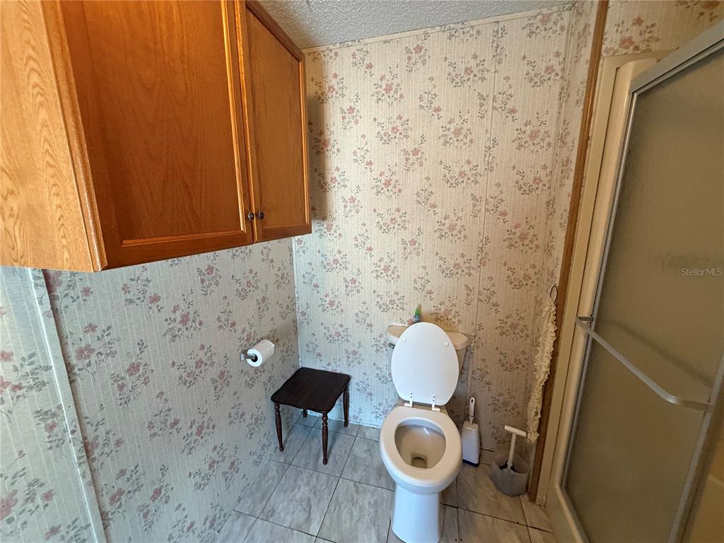 9300 Ottawa Street New Port Richey, FL 34654 - Photo 30 of 37 a bathroom with a sink and a mirror