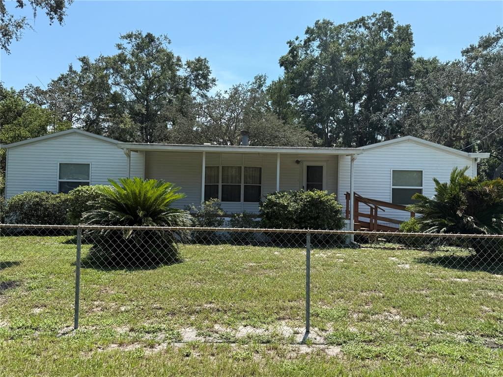 9300 Ottawa Street New Port Richey, FL 34654 - Photo 3 of 37 a view of a house with backyard and sitting area