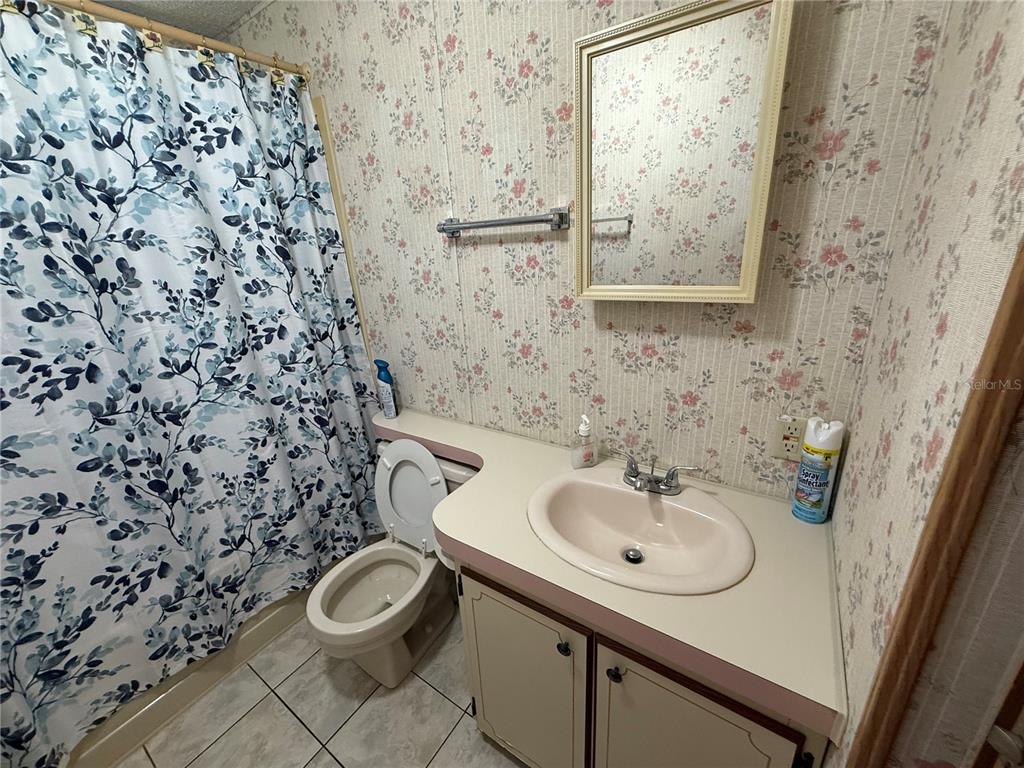 9300 Ottawa Street New Port Richey, FL 34654 - Photo 33 of 37 a bathroom with a sink and a toilet