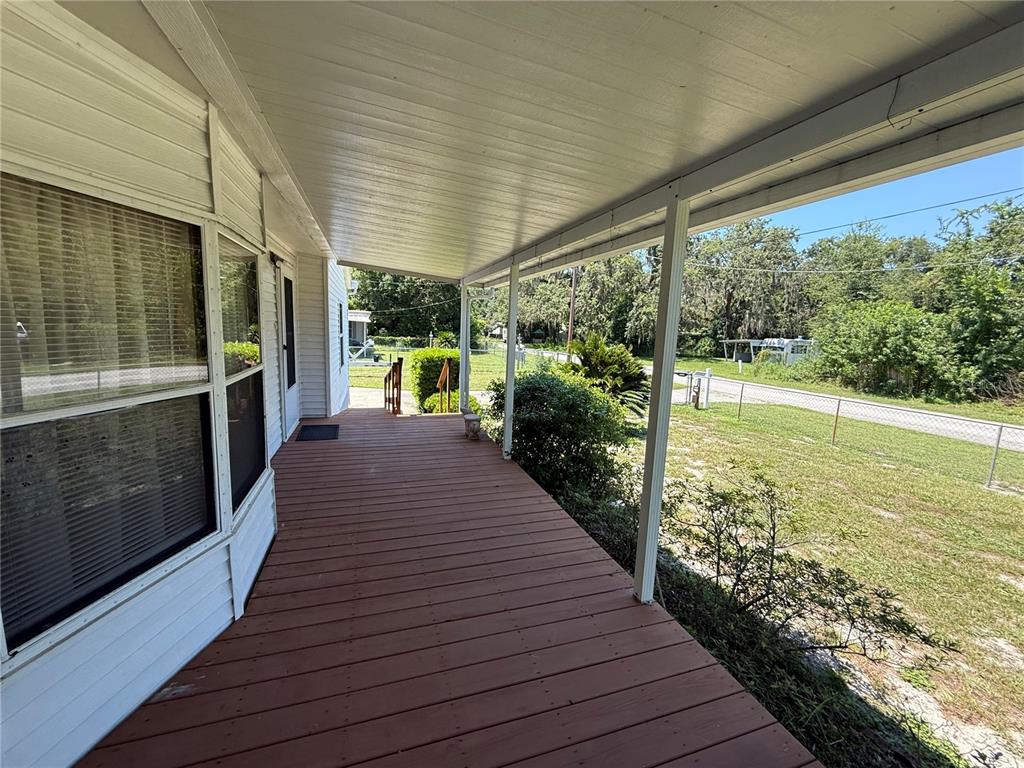 9300 Ottawa Street New Port Richey, FL 34654 - Photo 36 of 37 a view of a patio with wooden floor