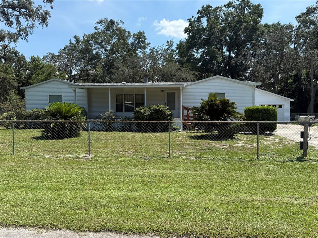 9300 Ottawa Street New Port Richey, FL 34654 - Photo 37 of 37 a backyard of a house with seating space