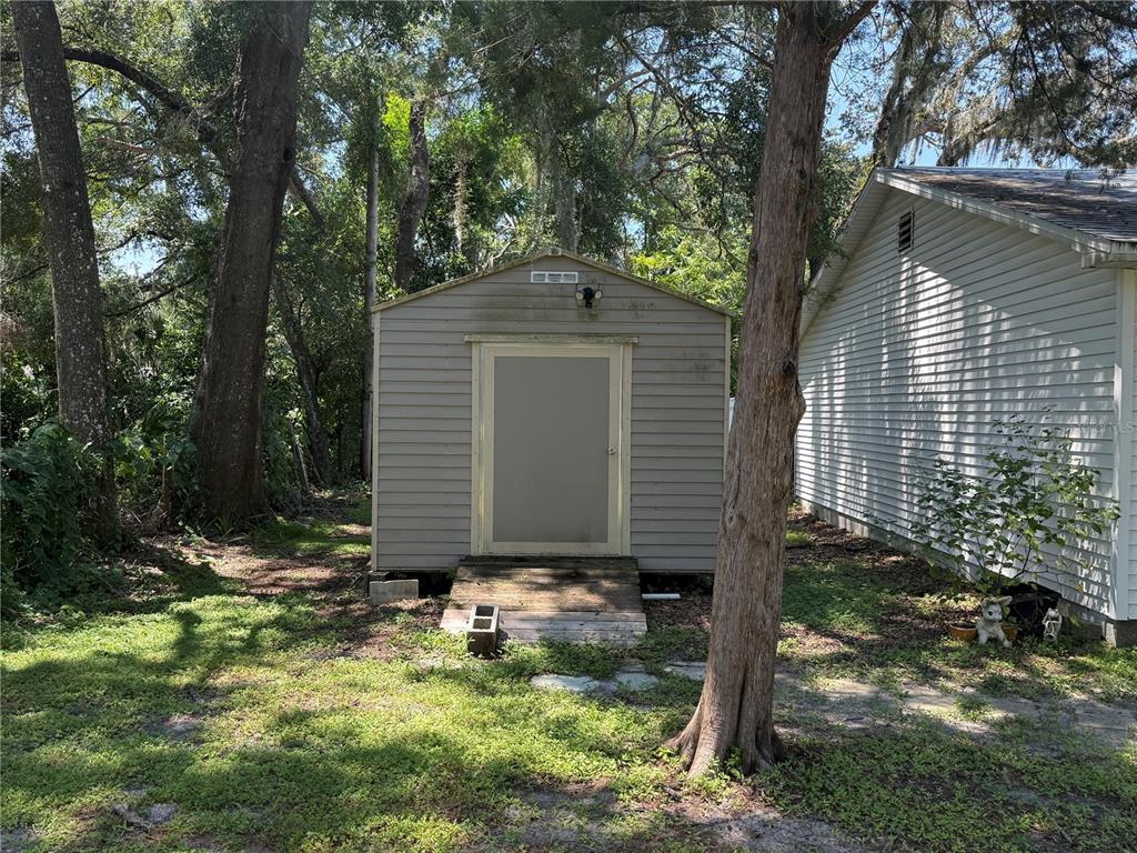 9300 Ottawa Street New Port Richey, FL 34654 - Photo 10 of 37 a front view of a house with a yard
