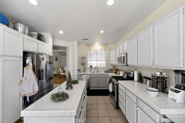 a kitchen with lots of counter top space and appliances