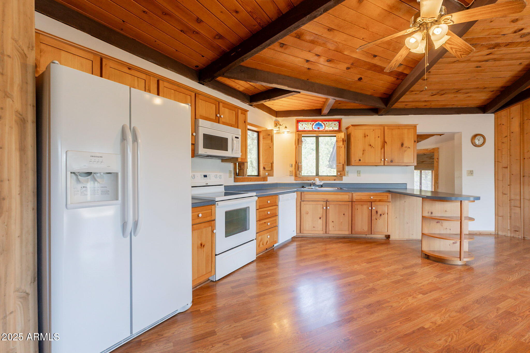 3524 Kelly Circle Pine, AZ 85544 - Photo 5 of 69 a kitchen with stainless steel appliances granite countertop a refrigerator and wooden floor