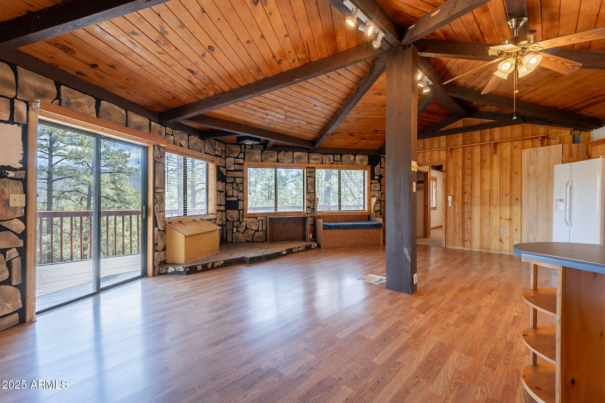 3524 Kelly Circle Pine, AZ 85544 - Photo 6 of 69 a view of a livingroom with hardwood floor and a ceiling fan